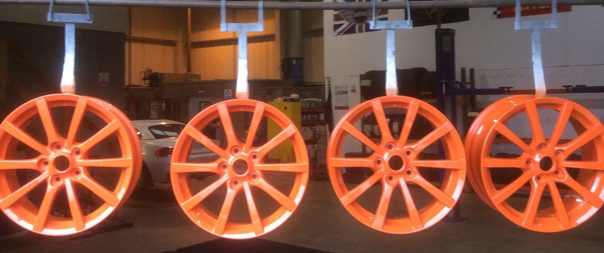 Set of alloy wheels powder coated in orange at Direct Finish York